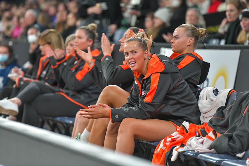 Letherbarrow claps the Giants on as she watches from the bench