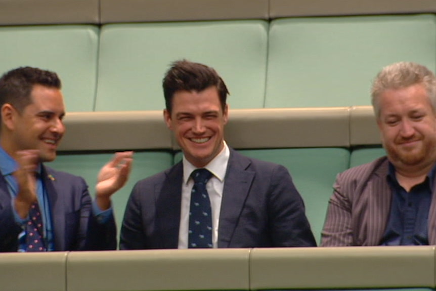 Ryan Bolger, partner of Tim Wilson, sits in the House of Representatives.