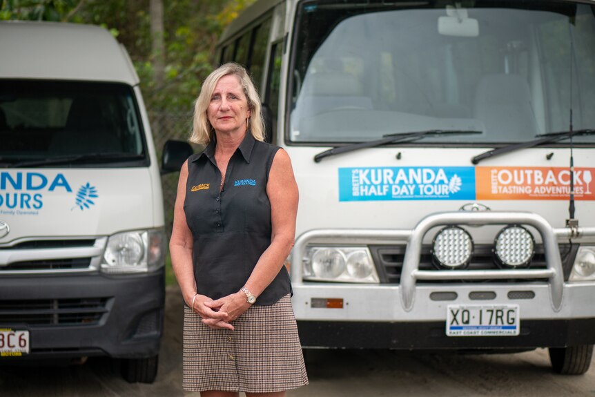 Tour operator Andrea Cameron stands in front of her buses, Port Douglas.