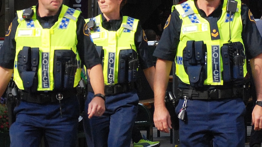 Tasmania Police officers on patrol wearing luminescent vests, generic image.