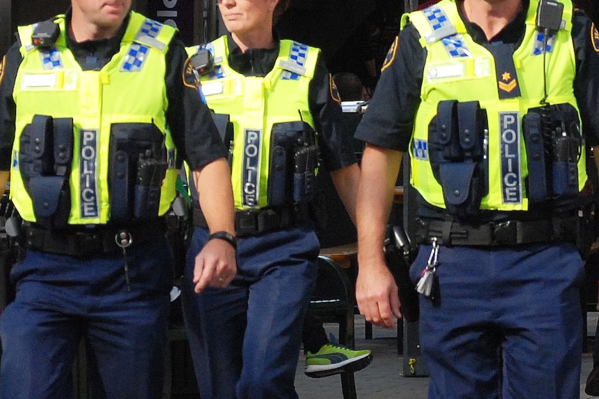 Tasmania Police officers on patrol wearing luminescent vests, generic image.