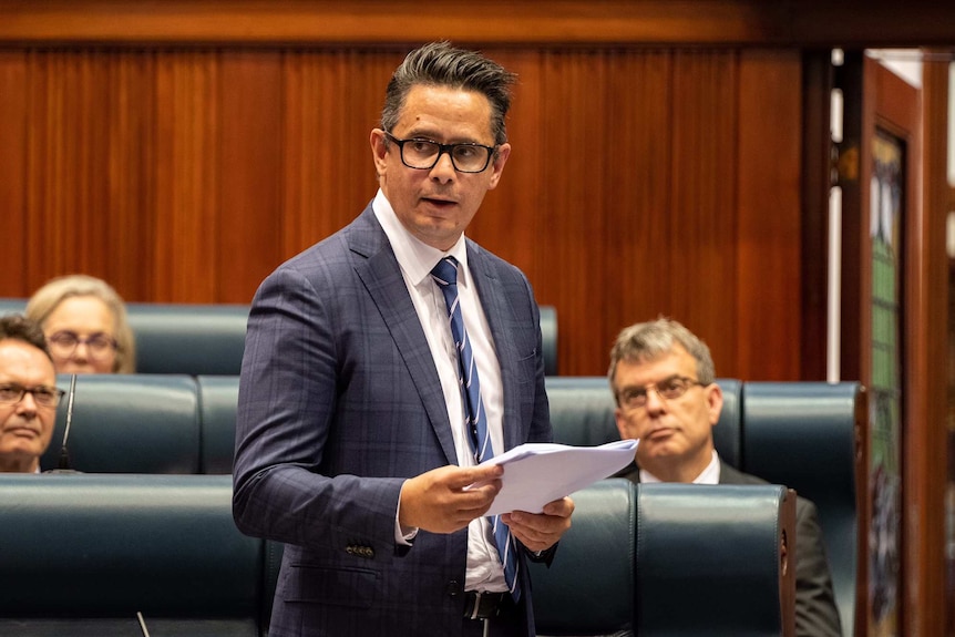 A mid-shot of WA Treasurer Ben Wyatt delivered his valedictory speech in State Parliament with MPs sitting behind him.