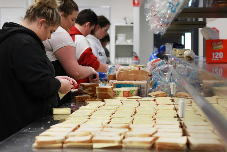 Vegemite and cheese sandwich-making production line