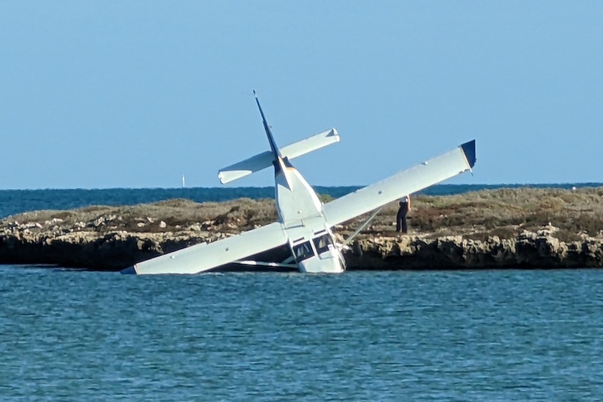 Image of a crashed aircraft sitting in the water off the Abrolhos Islands.