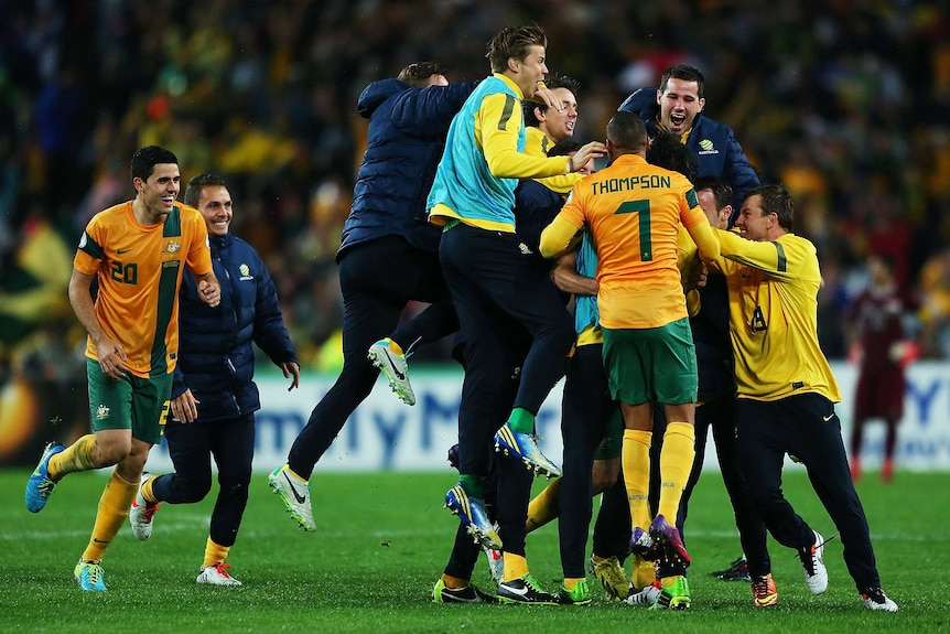 Socceroos celebrate Kennedy's winner