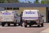 Police cars and officers at Heatley State School in Townsville where a teacher was stabbed by an 11-year-old student.