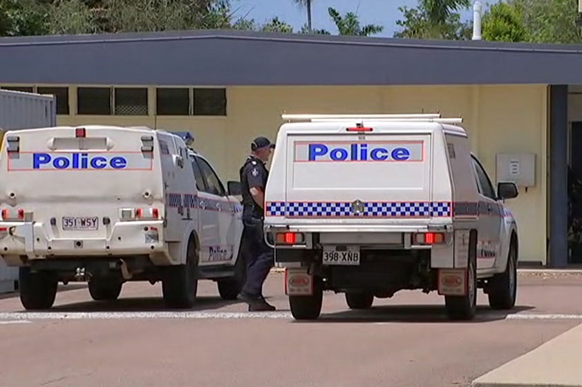 Police cars and officers at Heatley State School in Townsville where a teacher was stabbed by an 11-year-old student.