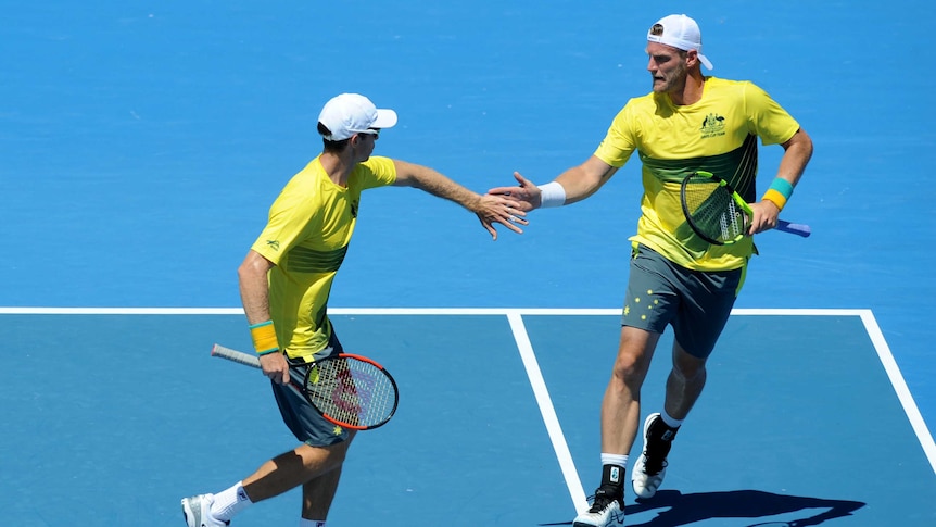 Sam Groth congratulates John Peers in Davis Cup doubles