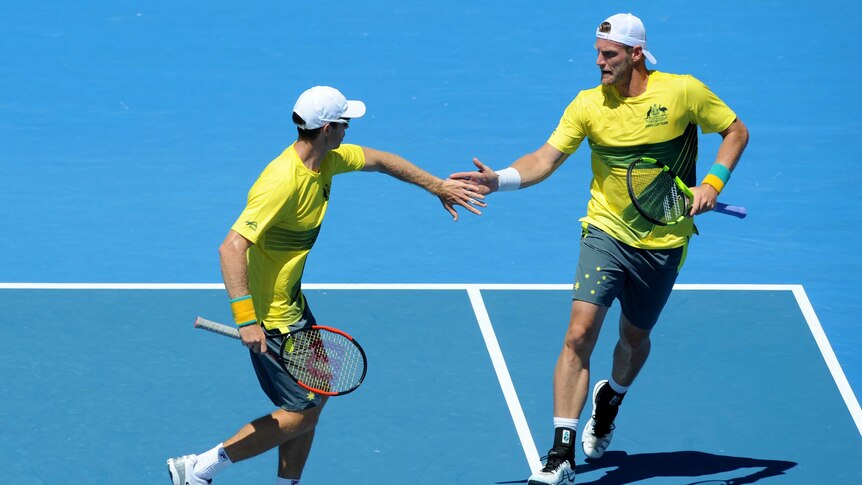 Sam Groth congratulates John Peers in Davis Cup doubles