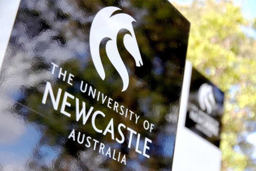 The University of Newcastle sign, emblazoned with a stallion's head.