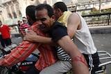 Morsi supporters carry injured demonstrator