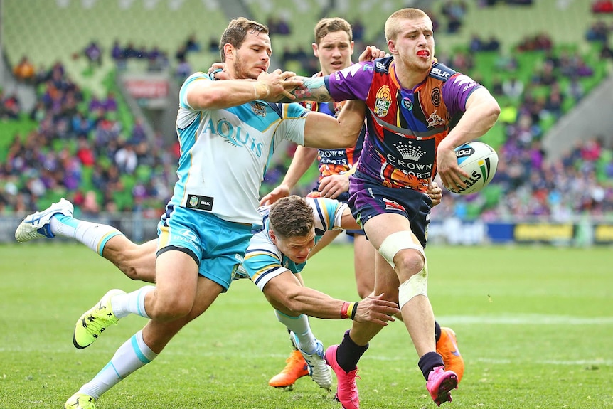 Cameron Munster pokes his nose through the Titans' defence