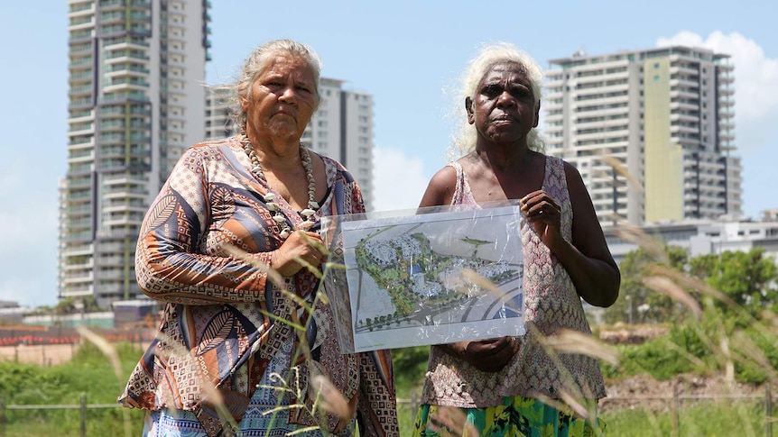A photo of Larrakia elder June Mills and One Mile Dam resident Mindy Timber holding a draft development plan.