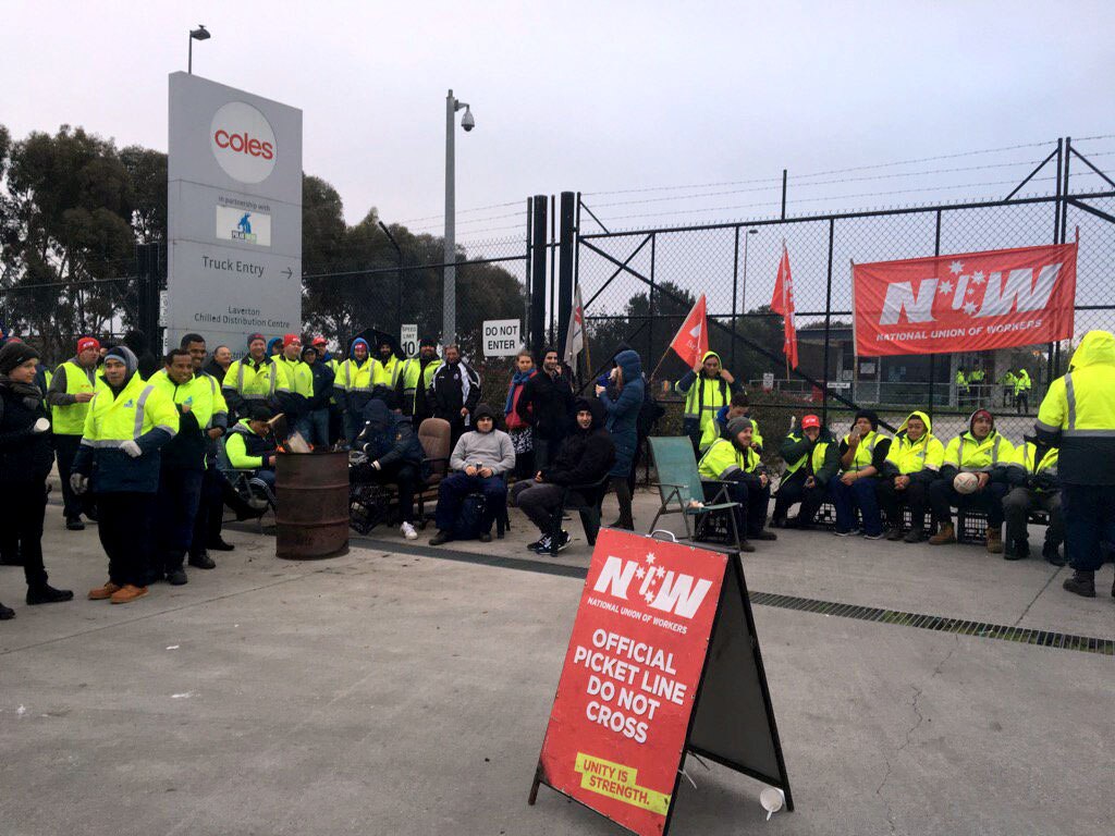 Coles food distribution centre workers strike over pay, job security