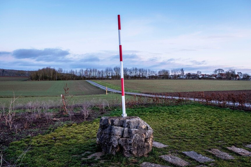 A red and white pole marks the new geographical centre of the European Union.