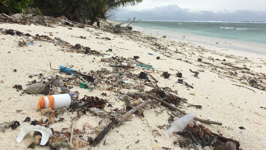 Close up of plastic debris and rubbish on a Cocos Island beach