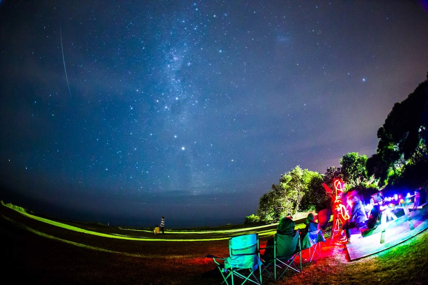Crowd gathers at Kiama to view the annual Geminids meteor shower.