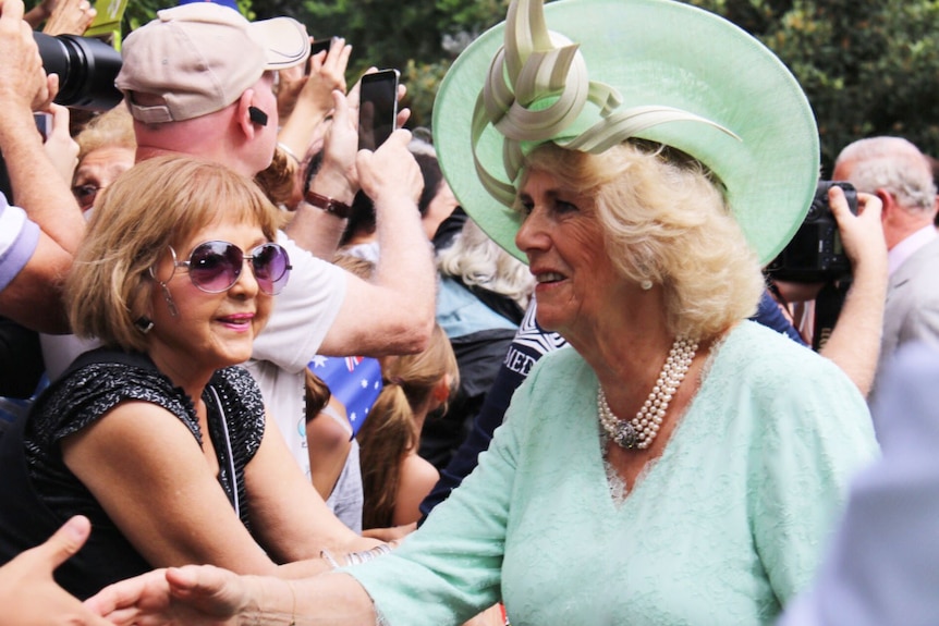 The Duchess of Cornwall greets royal watchers in Brisbane.