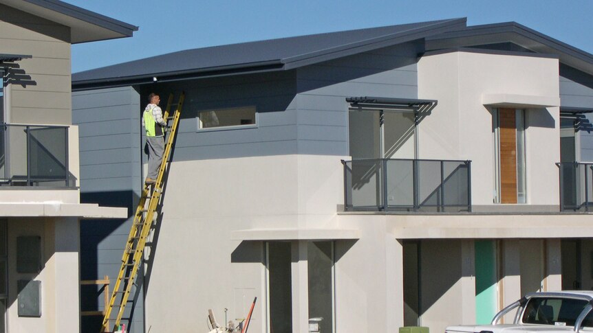 Builder working on a town house being built at McCubbin Rise in North Weston Canberra