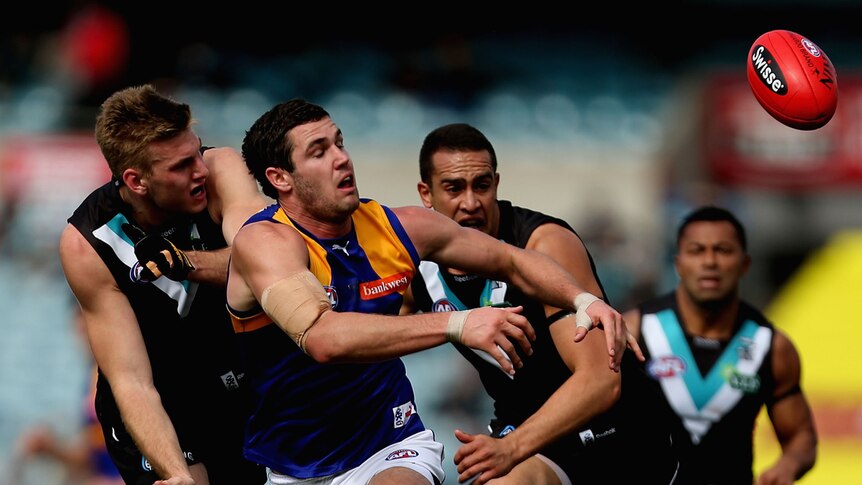 The Eagles' Jack Darling chased by Port Adelaide's Jackson Trengove.