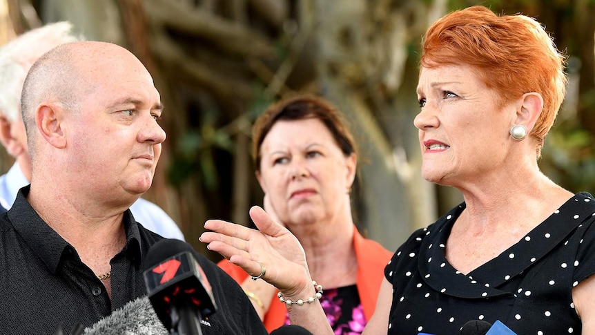 One Nation leader Pauline Hanson (right) gestures to Thuringowa candidate for One Nation Mark Thornton