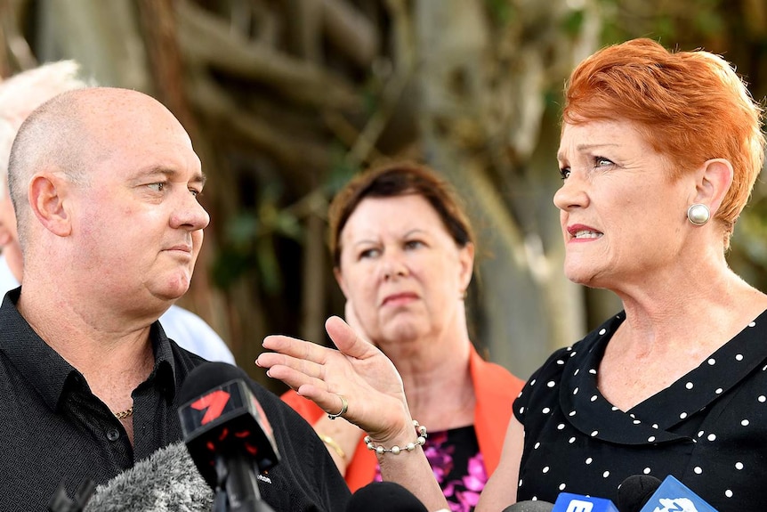 One Nation leader Pauline Hanson (right) gestures to Thuringowa candidate for One Nation Mark Thornton