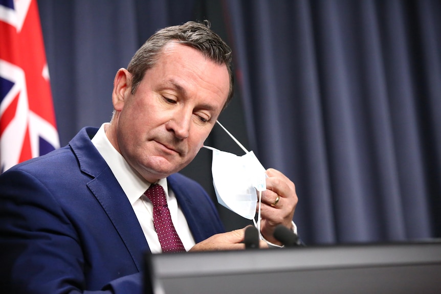 Mark McGowan takes mask off