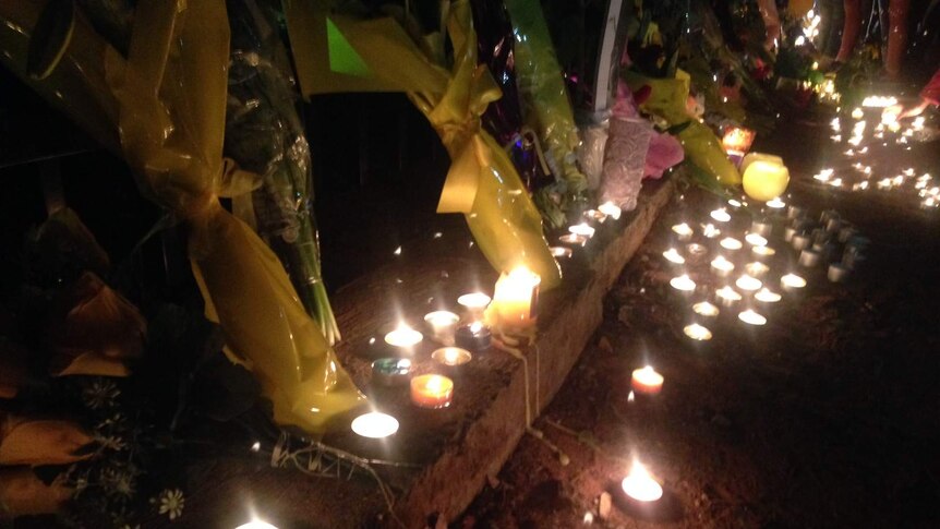 Flowers and candles in memory of Stephanie Scott