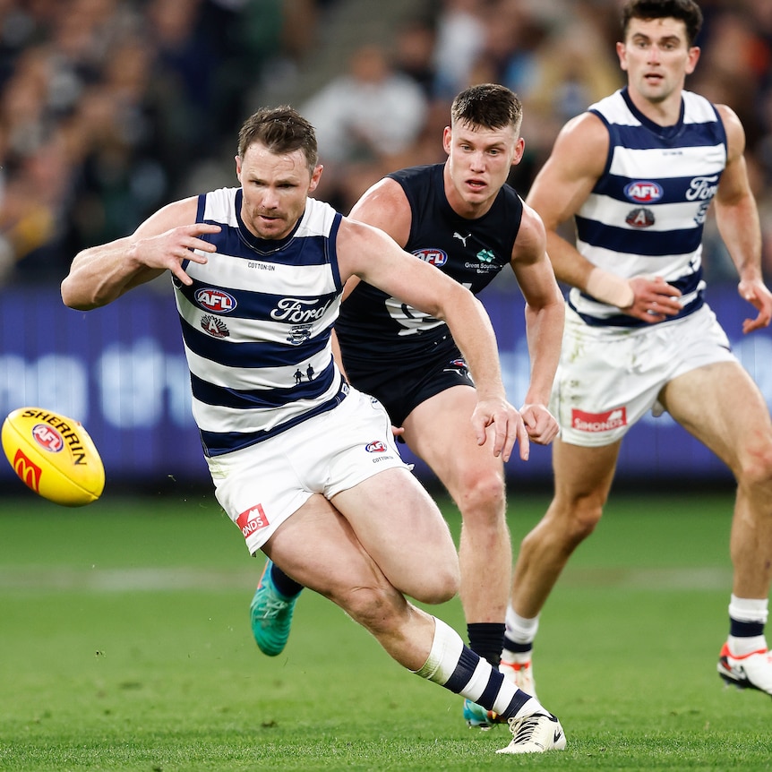 Patrick Dangerfield is chased by Sam Walsh