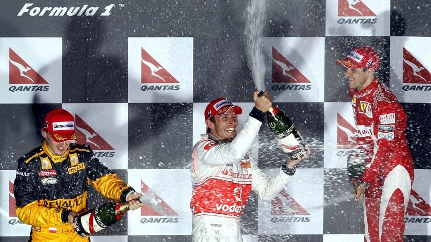 Splashing out: It was Button's first win for McLaren since switching from Brawn GP.