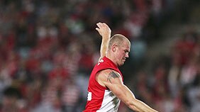 Barry Hall kicks one of his four goals for the Swans