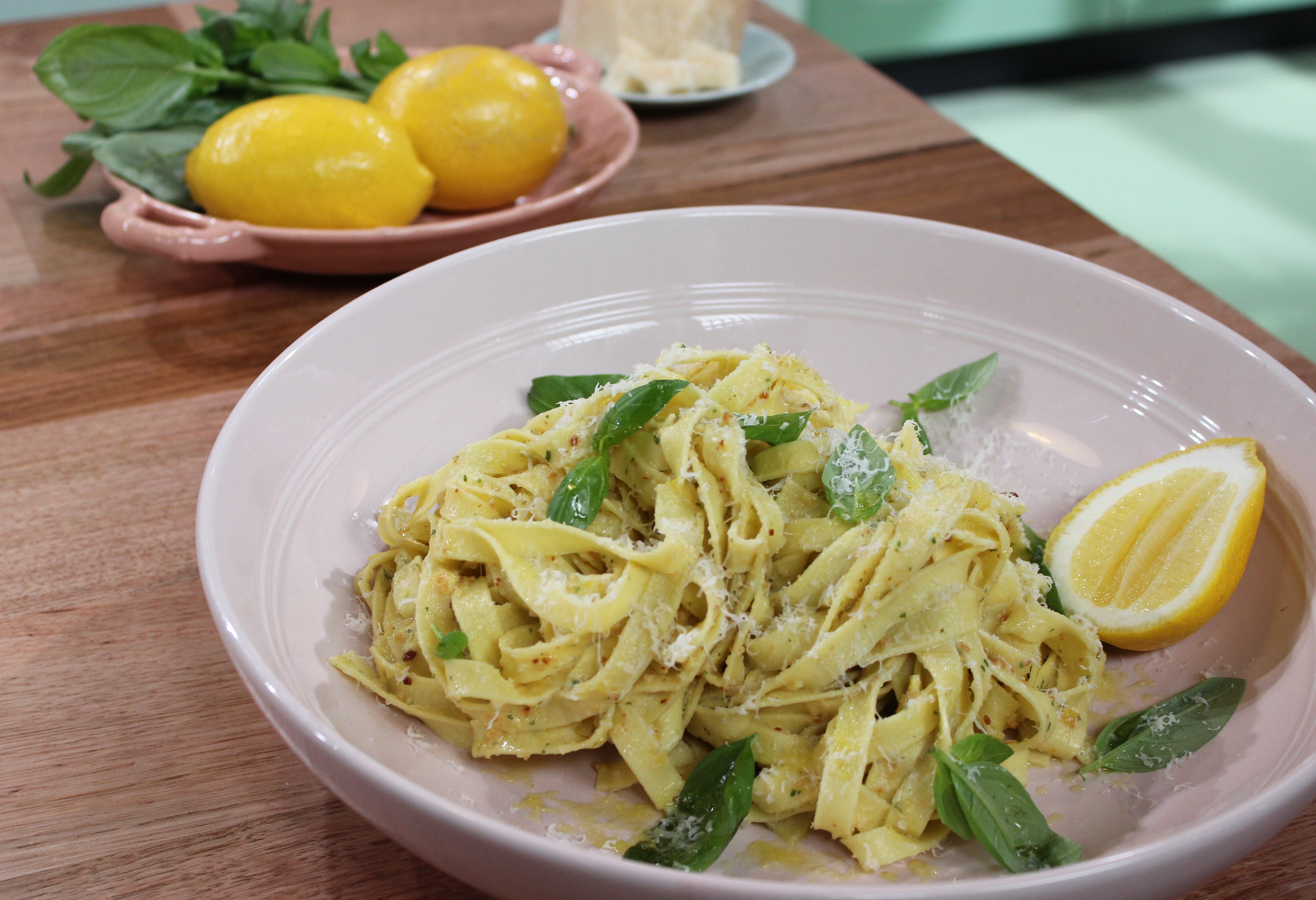Fettuccine and lemon pesto pasta in serving bowl finished dish in serving bowl