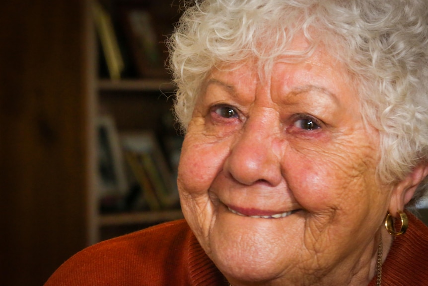 Aunty Fay Carter smiles at the camera.