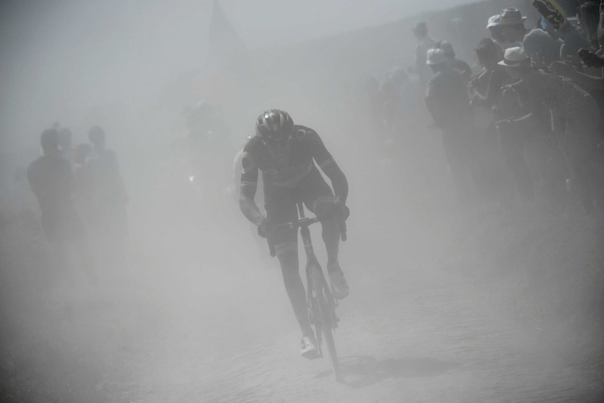 Damien Gaudin, front, ahead of Reinardt Janse van Rensburg on the cobblestones at Tour de France.