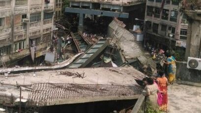 Road turns to rubble after bridge collapse as people watch on