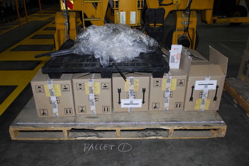 Boxes of coffee and cacao products seized by police which contained $105 million of cocaine.