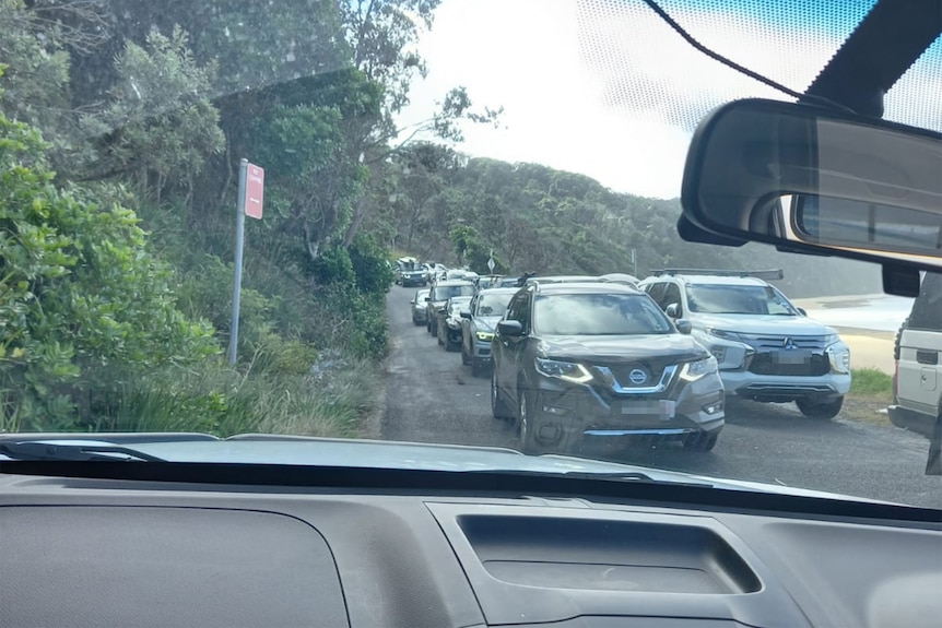 a regional road gridlocked with cars