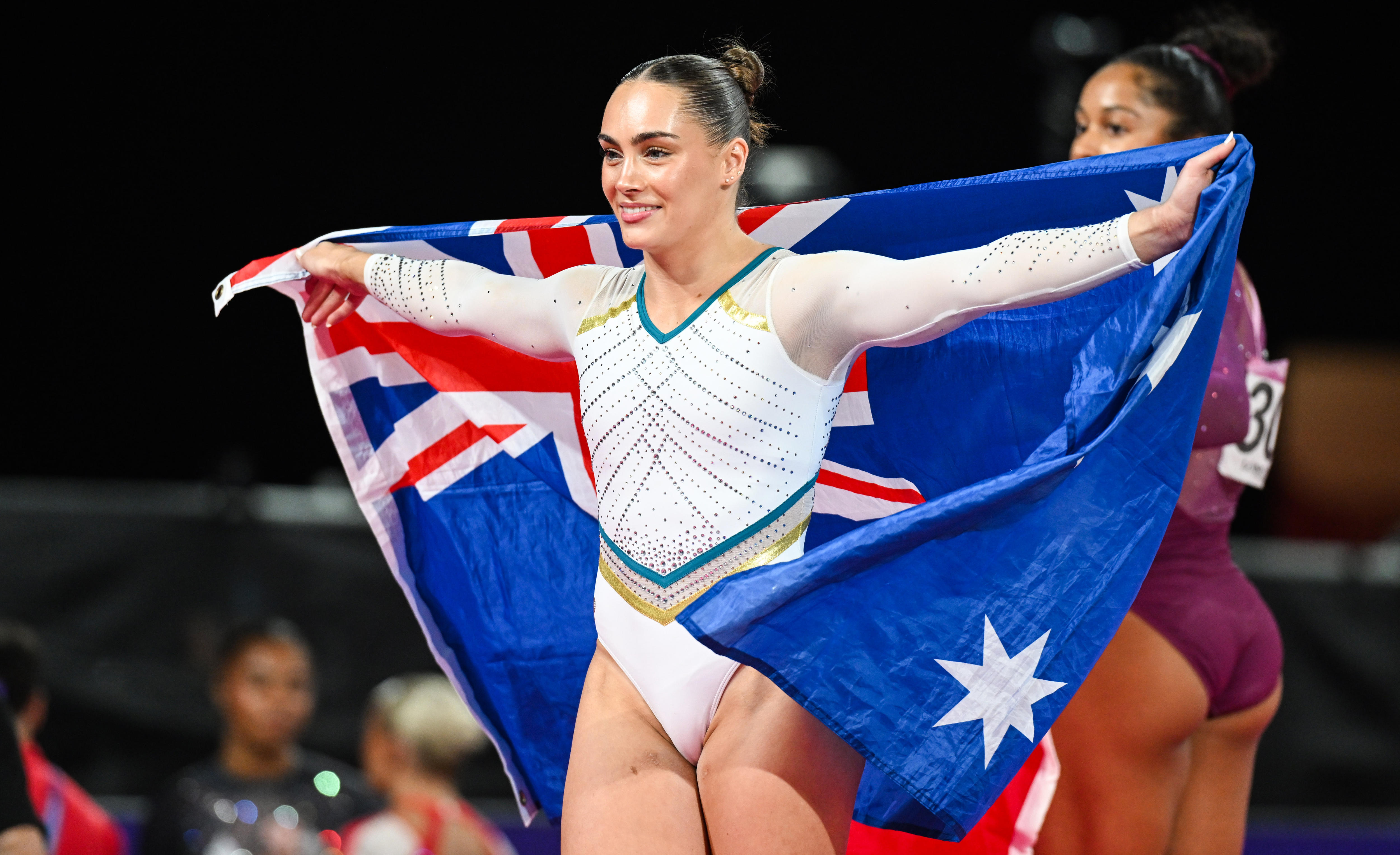 Breanna Scott holds an Australian flag
