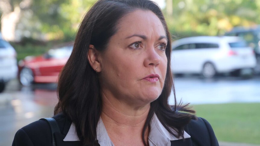 A head and shoulders shot of WA Opposition Leader Liza Harvey standing outside listening to a question from an unseen reporter.