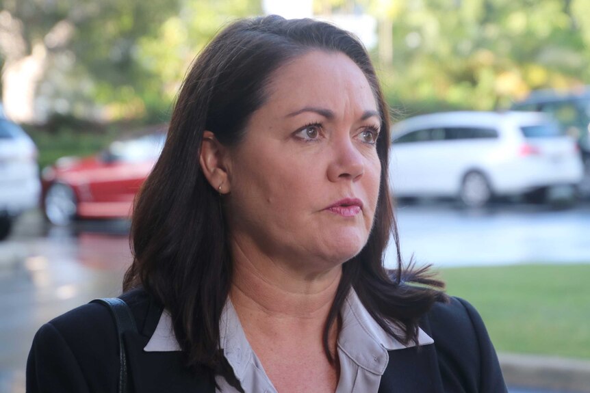 A head and shoulders shot of WA Opposition Leader Liza Harvey standing outside listening to a question from an unseen reporter.