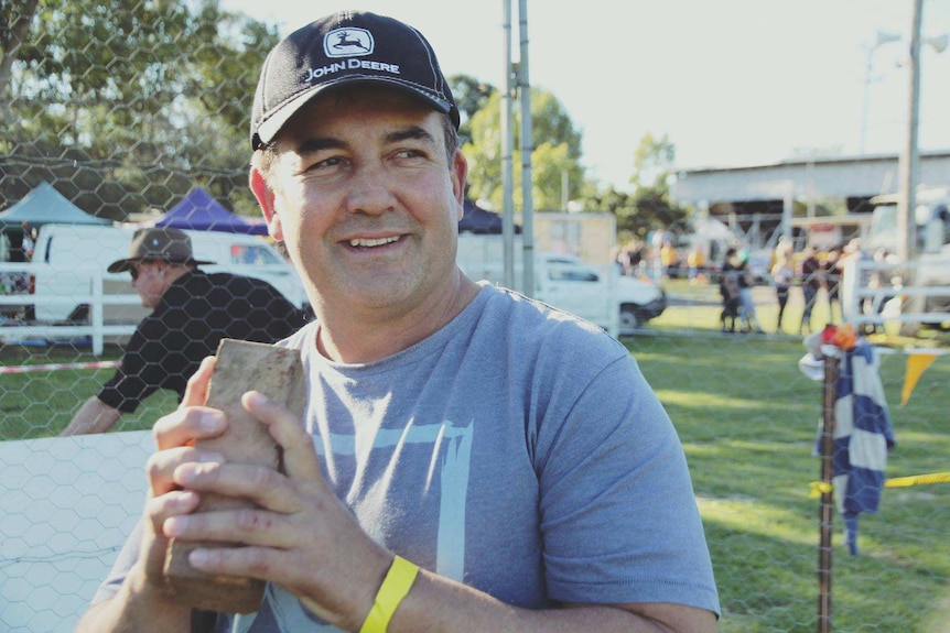 Man hold brink in hands before throwing