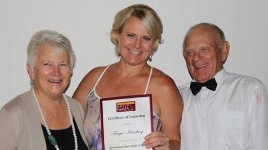 Tanya Harding accepts her Queensland sporting Hall of Fame induction with mum Sandra and dad Robert by her side.