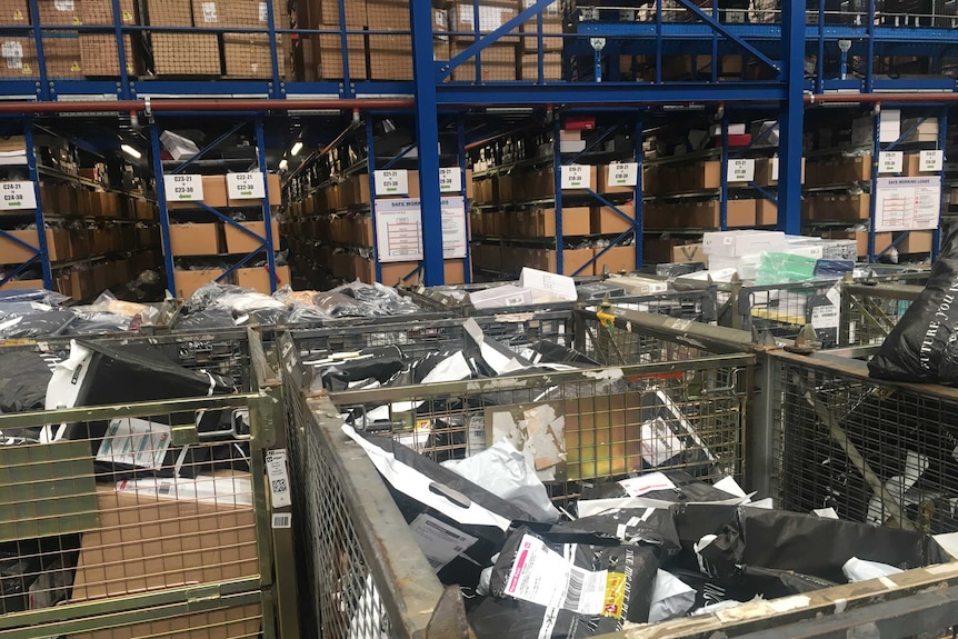 A large pile of returned clothing at The Iconic's warehouse in Sydney.