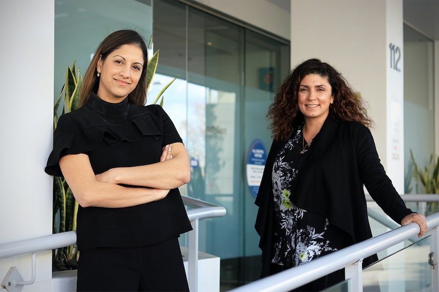 Karen Williams and Merrylord Harb-Azar stand outside the South Coast Private Hospital.