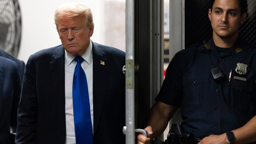 Donald Trump looks sad in a blue tie