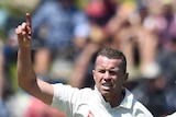Australian bowler Peter Siddle celebrates the wicket of New Zealand's Doug Bracewell in Wellington.