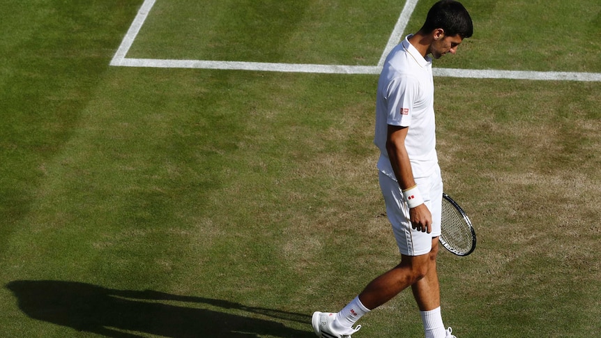 Novak Djokovic reacts after losing his match against USA's Sam Querrey.