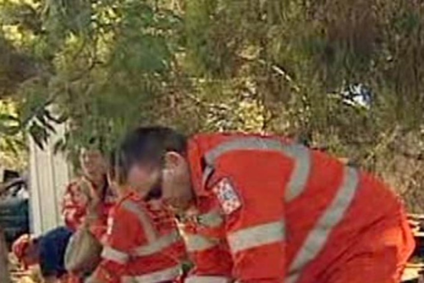 SES workers at Kerang work quickly to fill sandbags.