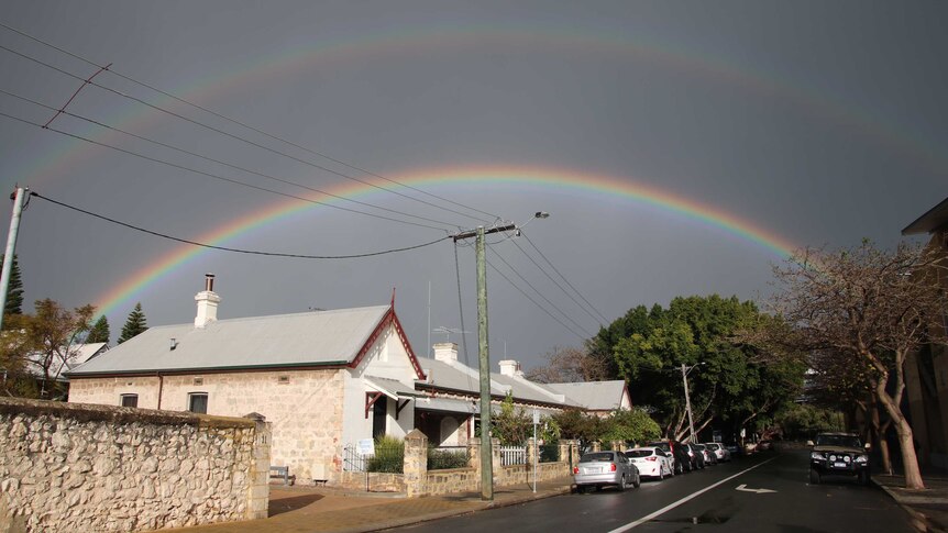 A double rainbow over a wet street after a storm in Fremantle WA.