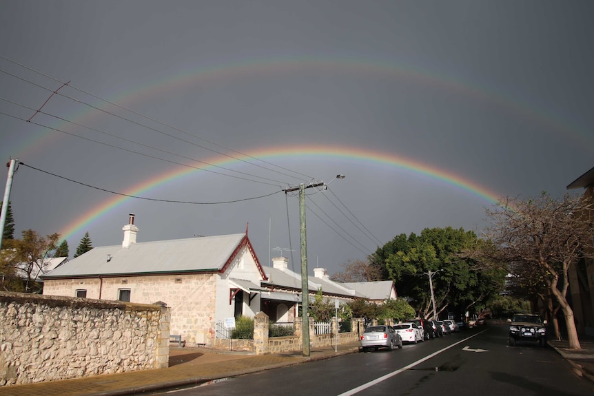 A double rainbow over a wet street after a storm in Fremantle WA.